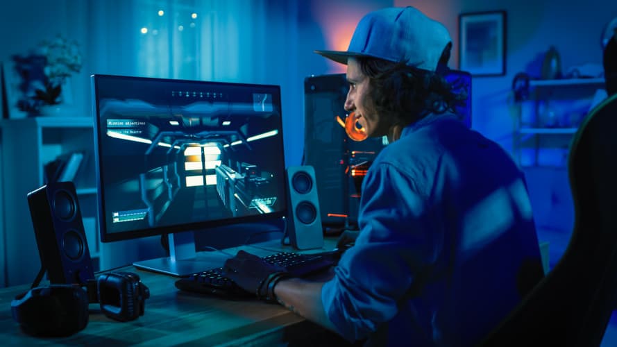 A Man With Cap Enjoying Computer Game